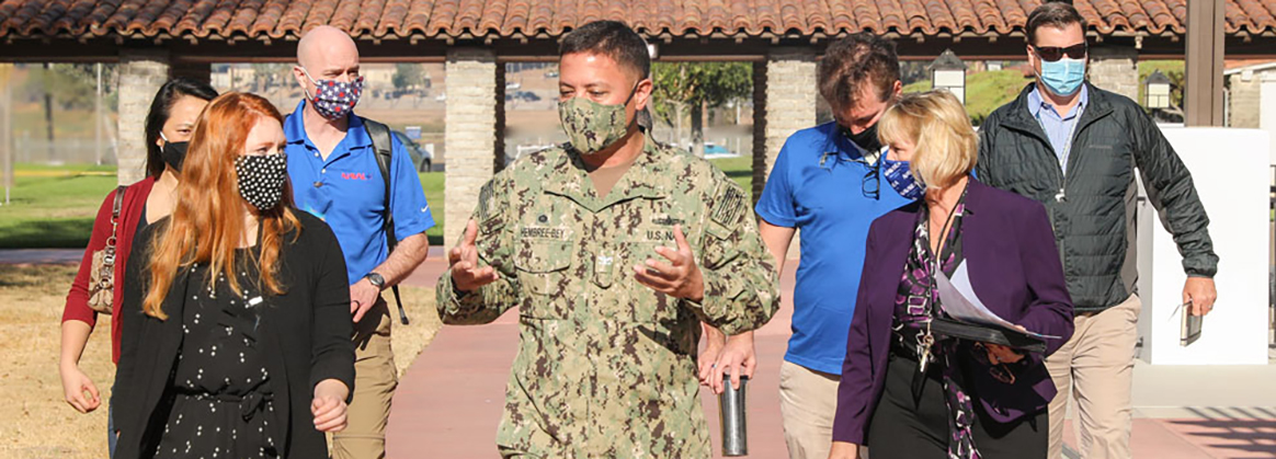 NSWC Corona Commanding Officer Captain Hembree-Bey(center) leads a base tour for distinguished visitors